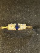 9ct Gold dress ring set with central sapphire & 2