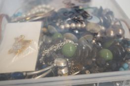 Unsorted box of costume jewellery