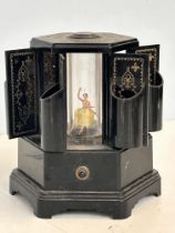 Bakelite cigarette dispenser with central lady dan