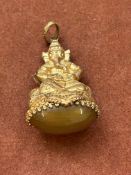 Yellow metal oriental Deity fob