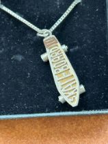 Silver skateboard necklace