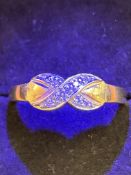 9ct Gold crossover ring set with diamonds Size O 2