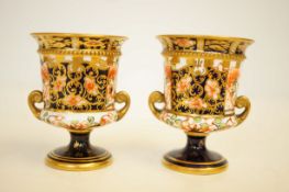 Pair of small Royal crown derby twin handled vases