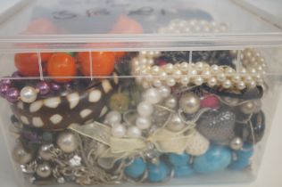 Unsorted box of costume jewellery