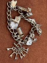 Silver charm bracelet - 11 charms