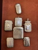 Collection of white metal vesta cases