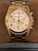 Michael Kors wristwatch with spare links & papers