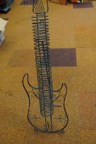 Storage rack in the form of a guitar