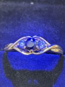 9ct Gold ring set with sapphire & 2 cz stones Size