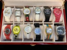 Collection of wristwatches in display case