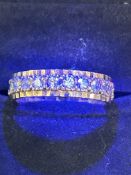 9ct Gold eternity ring surrounded by white stones