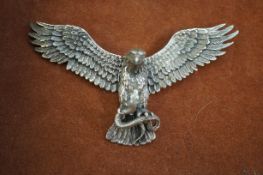 Silver articulating eagle