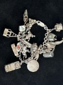 Silver charm bracelet - 21 charms