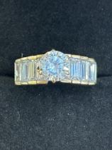 9ct Gold ring set with 8 baguette stones & single