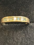 9ct Gold ring set with 4 aquamarine & 3 cz stones