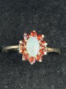 9ct Gold ring set with opals & garnets Size Q 1.5g