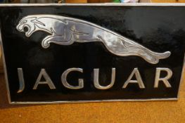 Large chrome jaguar sign