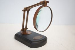 Brass Magnifying glass on wooden base
