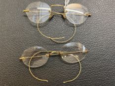 Pair of spectacles with 9ct gold pads & 1 other pair