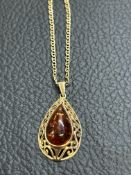9ct Gold chain & pendant, pendant set with amber t