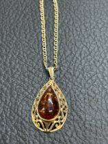 9ct Gold chain & pendant, pendant set with amber t
