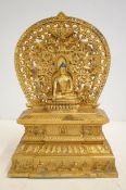 Gilt bronze repousse throne & aureole buddha statu
