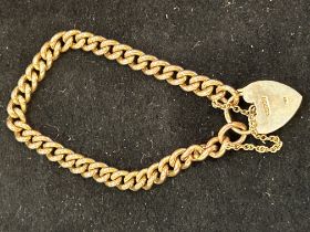 9ct Gold bracelet with heart locket and safety cha