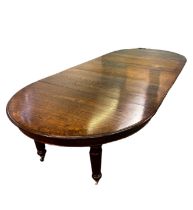 An early 20th century 8 legged boardroom table wit