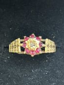 9ct Gold ring set with central diamonds & garnets