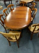 Extending dining table with 8 rush seat chairs