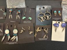 12 Pairs of silver earrings