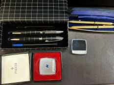 2 Cased pen sets together with 2 Parker tape measu