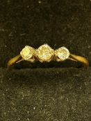 3 Diamond ring set in platinum on yellow metal rin