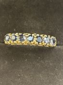 9ct Gold ring set with 7 blue stones Size Q 2.2g