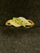 9ct Gold ring set with 3 peridot stones & diamonds