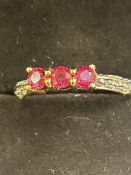 9ct Gold ring set with 3 red stones 2.4g Size O