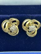 Pair of 9ct gold earrings set with chip diamonds