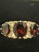 9ct Gold ring set with garnets & cz stones Size S