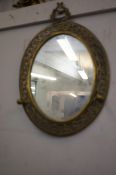 Early 20th century brass mirror with coat hooks