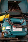 Makita 110v jigsaw together with box of heavy duty