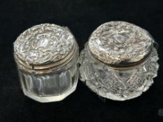 2 Silver top glass pots