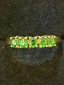 9ct Gold ring set with 5 green stones Size O 2.3g