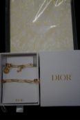 Dior necklace & Dior note pad