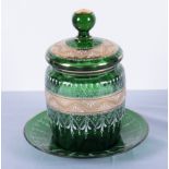 A Victorian highly decorated green glass biscuit barrel and plate, 23cm