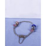 A Pandora style bracelet and charms