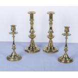 Two pairs of brass candlesticks