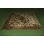 A Louis de Poortere large brown and mustard ground wool rug, 250cm x 250cm