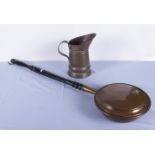 A copper warming pan and a large jug