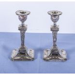 A pair of silver candlesticks 16cm tall marks for Sheffield