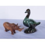 A Blue Mountain pottery duck and a wood rhinoceros